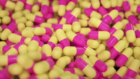 pink and yellow capsules