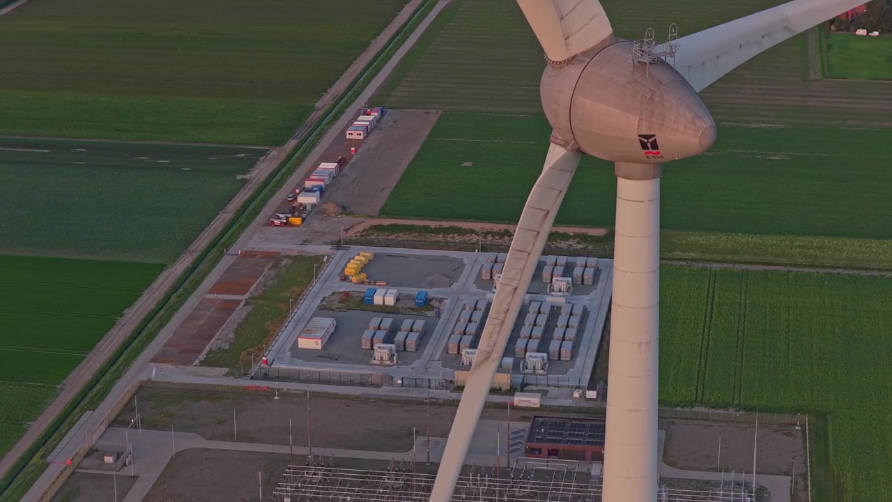 Aerial View of Wind Turbine and Battery Energy Storage System