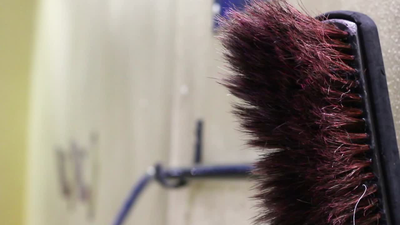 Rack focus of a self serve car wash brush.