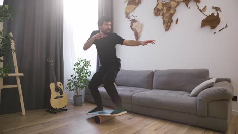 men on deck for balance stands with his feet, pretending he is surfing