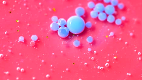 bright collors bubbles slow motion oil ink. structure of colorful chaotic motion bubbles. bright collors bubbles. pink and blue bubblegum flavor background. drops of colors moving. pop bubbles