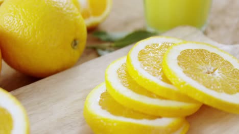 close-up of sweet limes with glasses of juice