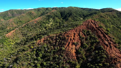 aerial view of rolling hills green landscape brown clay in kauai hawaii