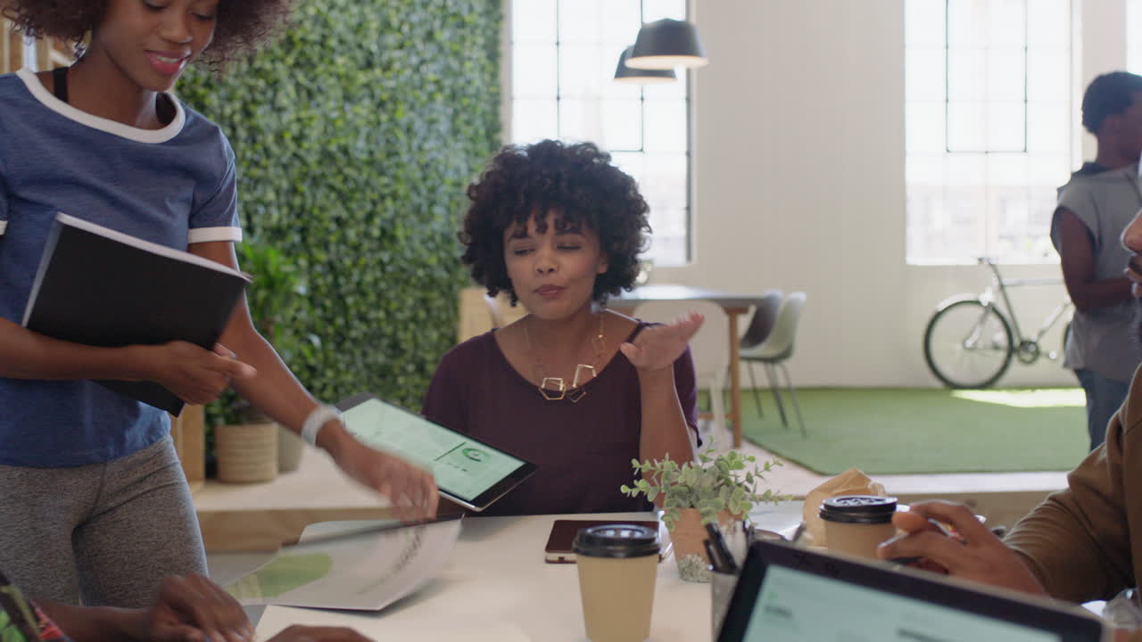 african american business people meeting brainstorming team leader woman presenting finance data using tablet technology sharing project strategy colleagues working together in office boardroom