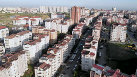 aerial city view with apartments houses and traffic on the roads on a winter day