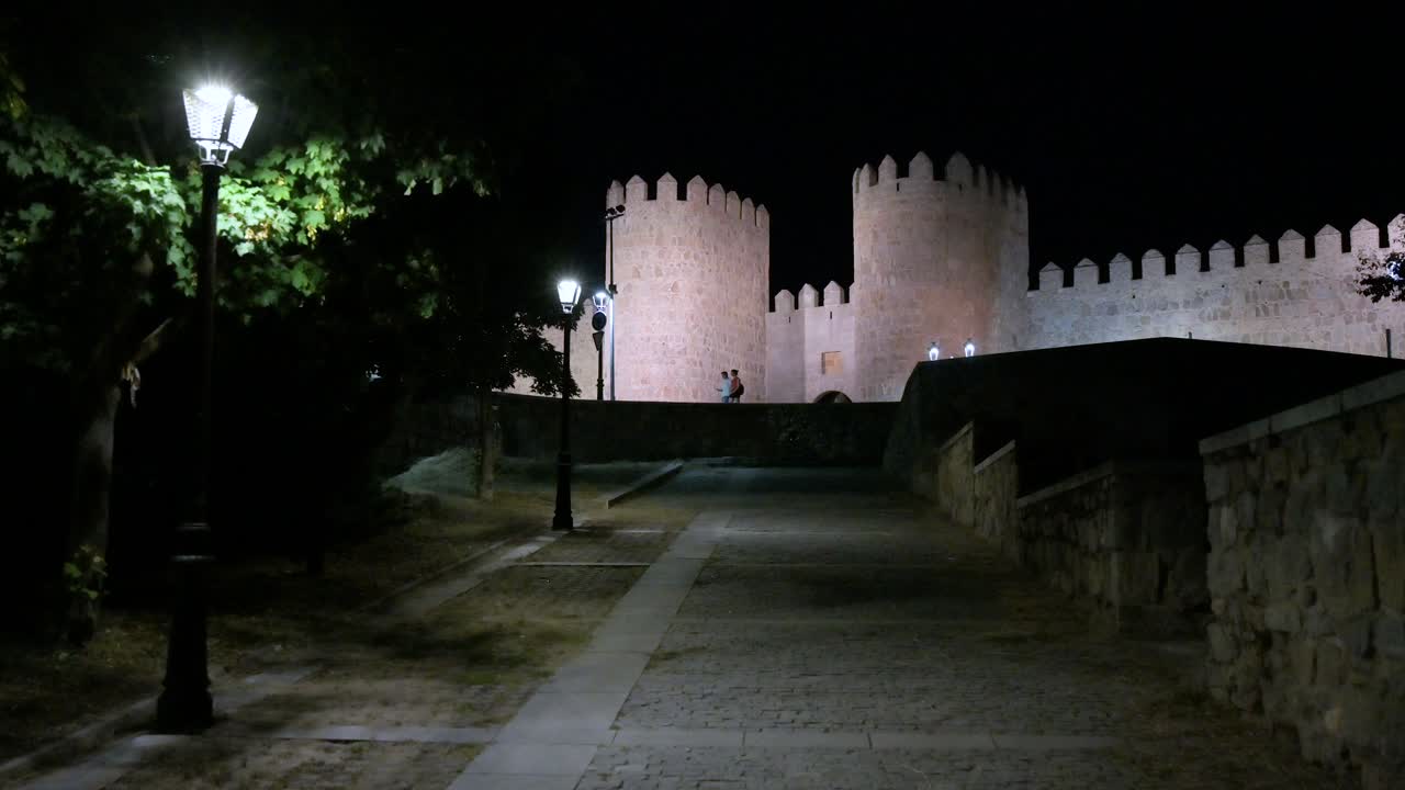 Avila's old town at night, featuring the glowing, UNESCO-designated medieval walls.