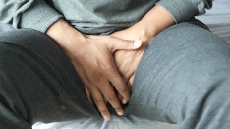 person examining their groin