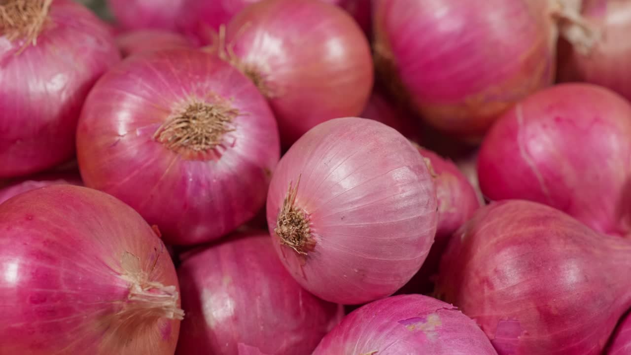 natural Fresh Organic Indian red onions. close up shot, parallax shot, 4k.
