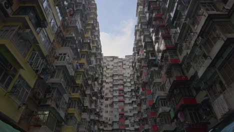 cinematic shot of a old chinese public housing building from the 60's during the day