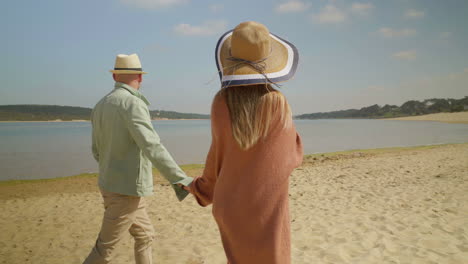 back view of couple talking and walking outdoor