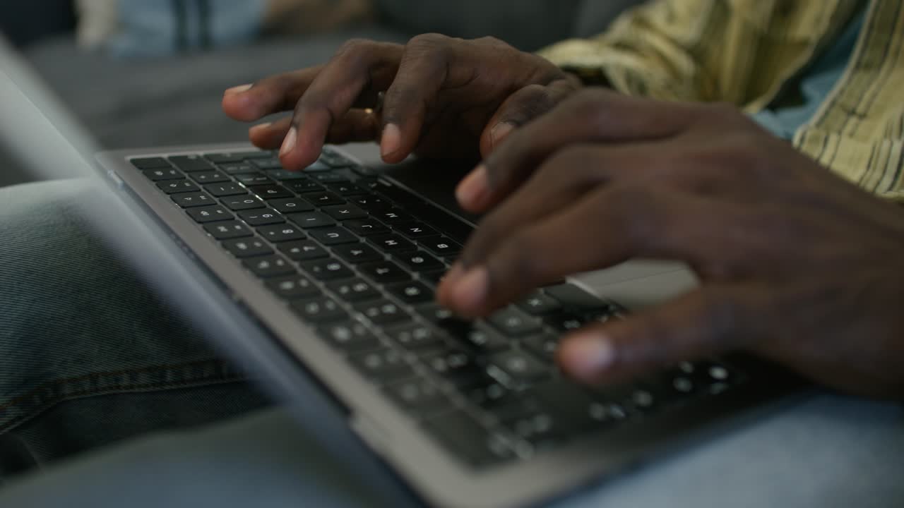 Person Typing on Laptop