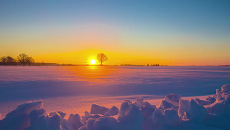 beautiful orange and purple sunrise over a landscape covered in snow