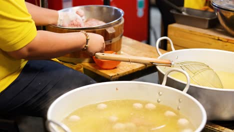 preparing meatballs at khlong lat mayom market