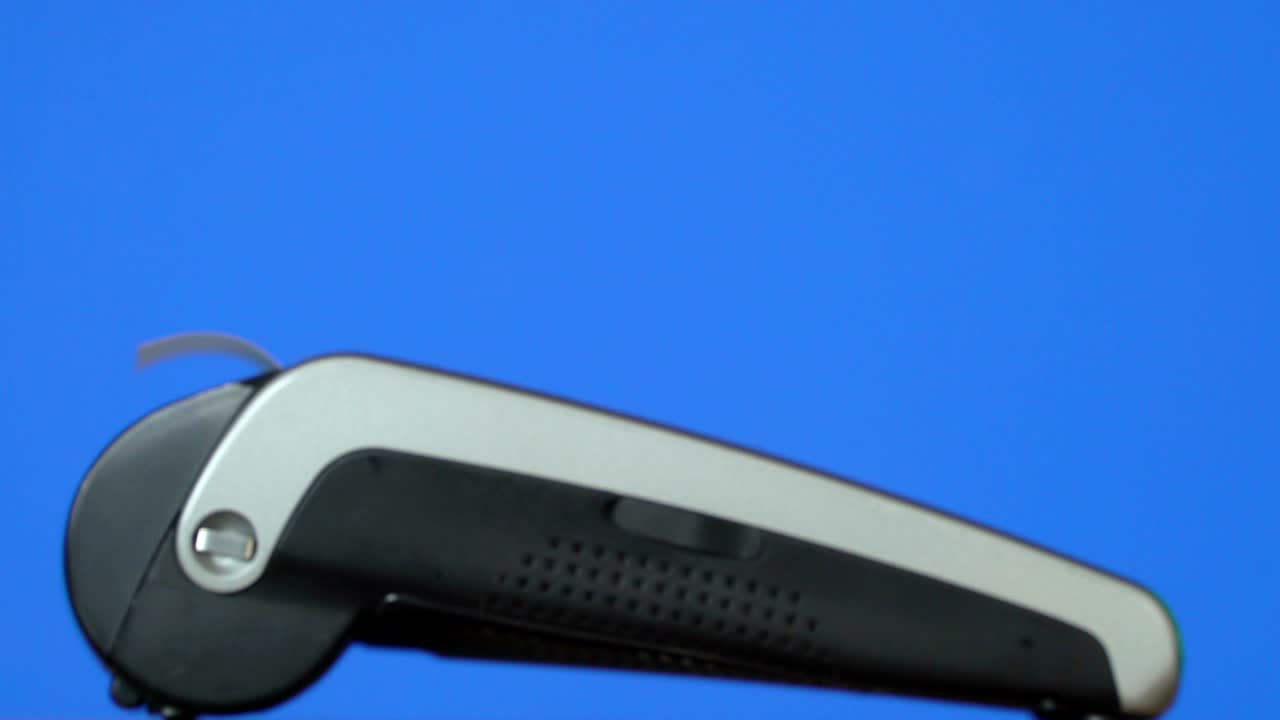 Concept credit card payment terminal. Check printing machine revolves. Blue background keying. Loop