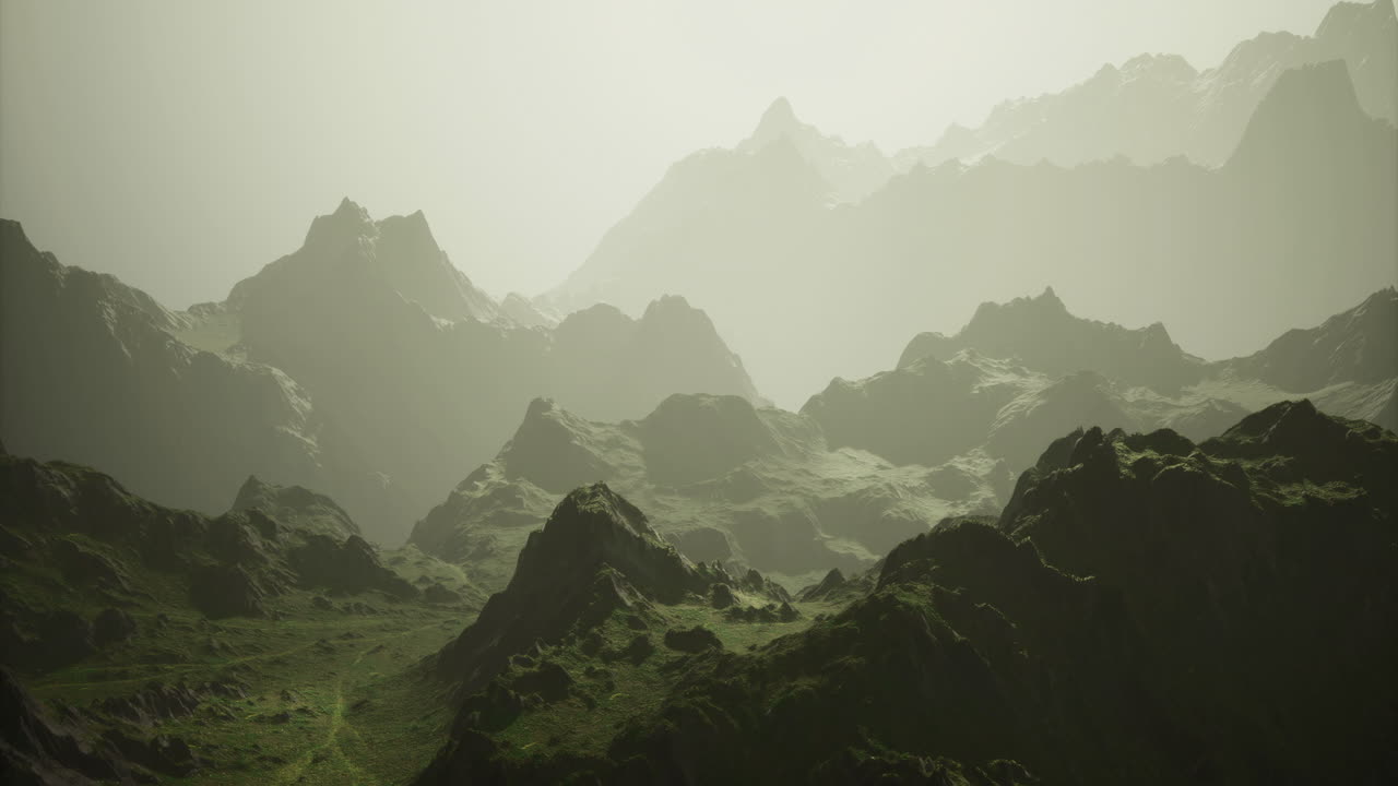 Majestic mountain landscape enveloped in mist at dawn