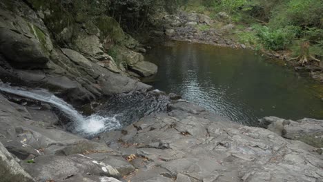 Mount-Cougal-Waterfall-And-Rock-Pools-By-Rainforest---Cougal-Cascades-At-Currumbin-Valley,-Queensland,-Australia