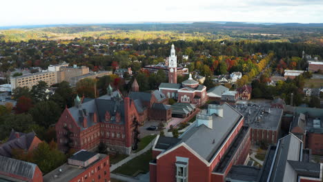 stunning fly over aerial shot overlooking the beautiful university of vermont campus, burlington vermont