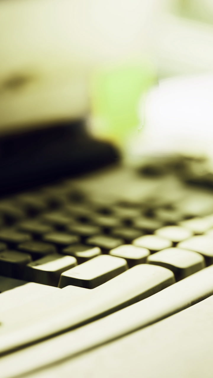 Vintage keyboard creates nostalgia in a cozy workspace surrounded by light