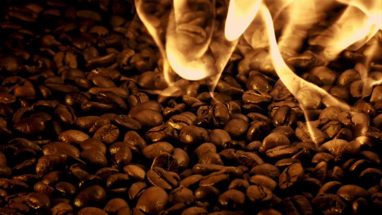 Close-up of Hot Coffee Beans with Rising Smoke
