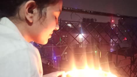 an old woman celebrating diwali happily ,
