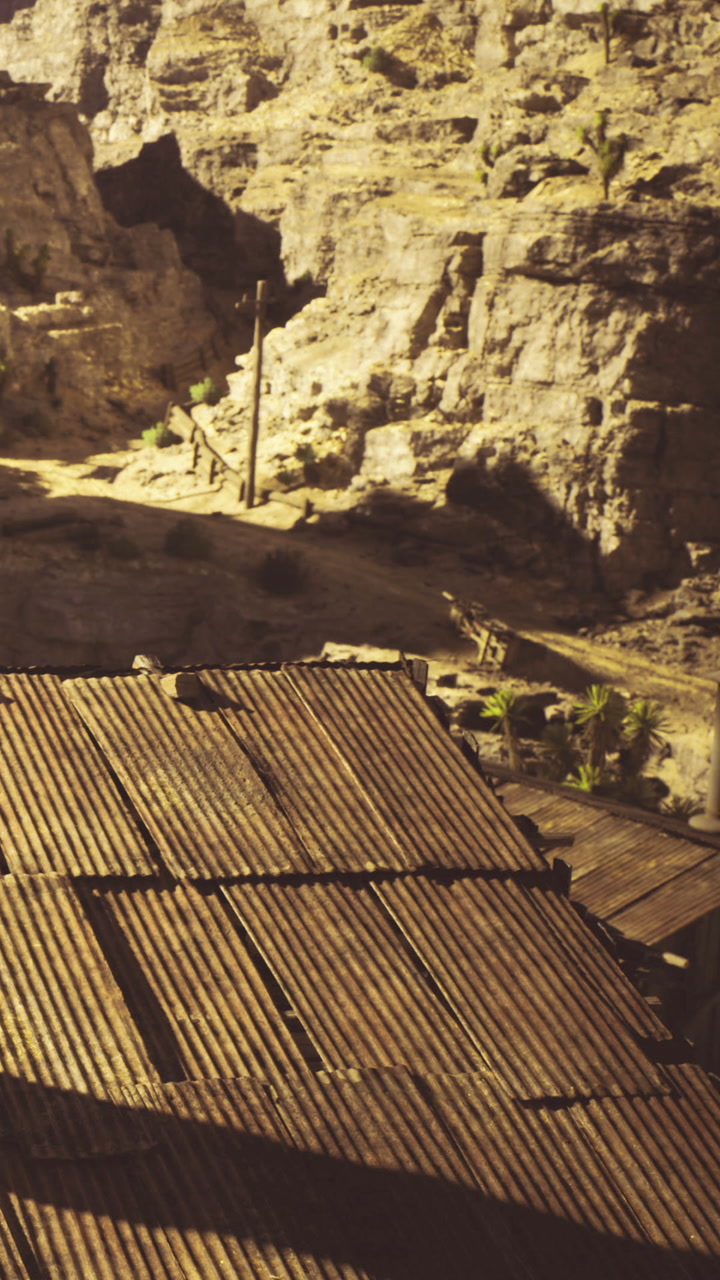 Rustic landscape revealing a weathered roof against rocky terrain