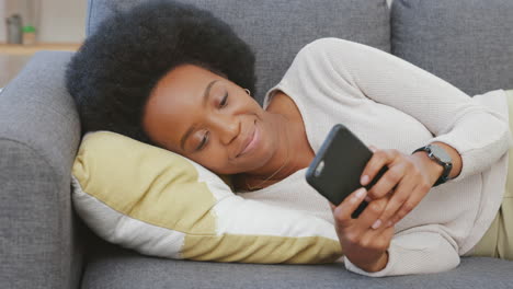 Relaxed-woman-texting-on-her-phone