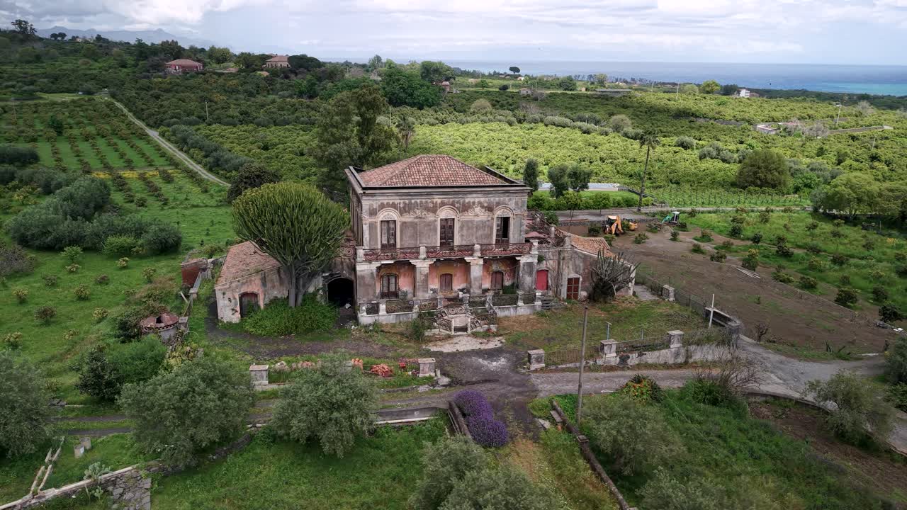 Abandoned Villa di Don Ciccio Godfather Part II Film Location With Rural Plantation In Background In Sicily, Italy. Aerial Orbiting Shot