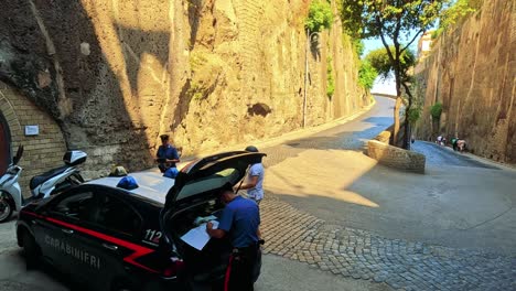 police officers interacting near a scenic road