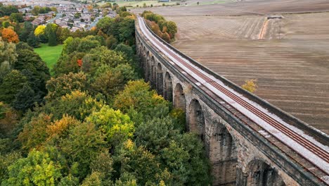 drone aerial video footage of the penistone viaduct a curved railway viaduct which carries the railway over sheffield road and the river don