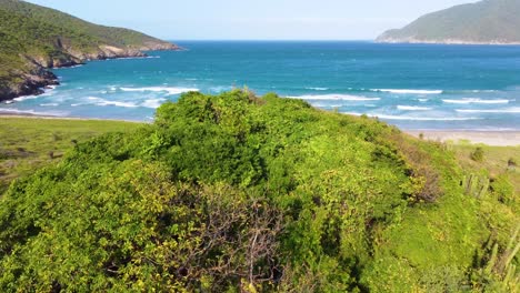 Tayrona-National-Park-with-lush-greenery-and-stunning-coastal-waters,-aerial-view