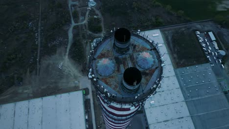 Aerial-view,-circular-camera-movement-around-the-idle-chimney