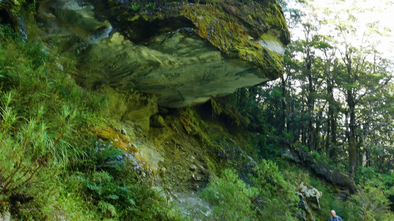 hiker notices dramatic rock overhang and runs fast to avoid it