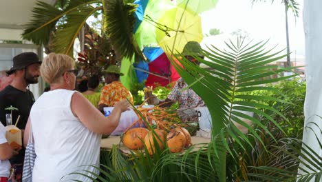 mahe, seychelles, 22.09.24, tourism festival week 2024, in town victoria, tourist buying local chips in kiosk 30fps