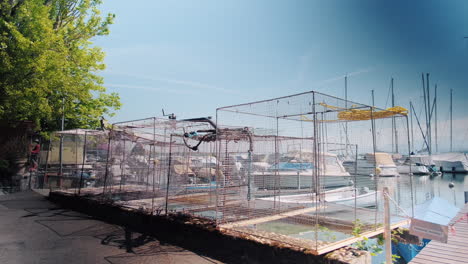 wide shot of fishing net in nyon fishing port during the day in canton of vaud, switzerland, outdoor