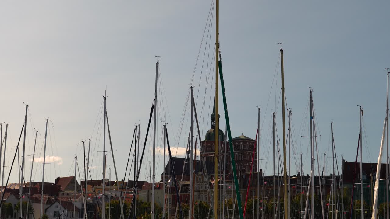 Sailboats in a Harbor with a City Skyline in the Background