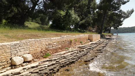 the remains of a roman villa are being eroded by sea water