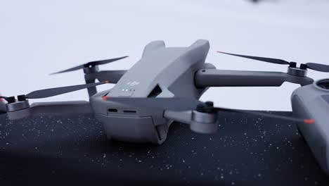 close-up of a drone with extended propellers on a snowy background