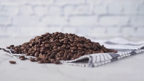 pile of roasted coffee beans on a napkin