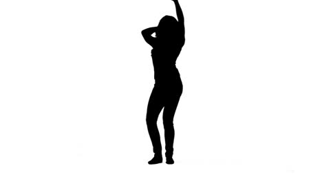 silhouette of a woman on her own dancing