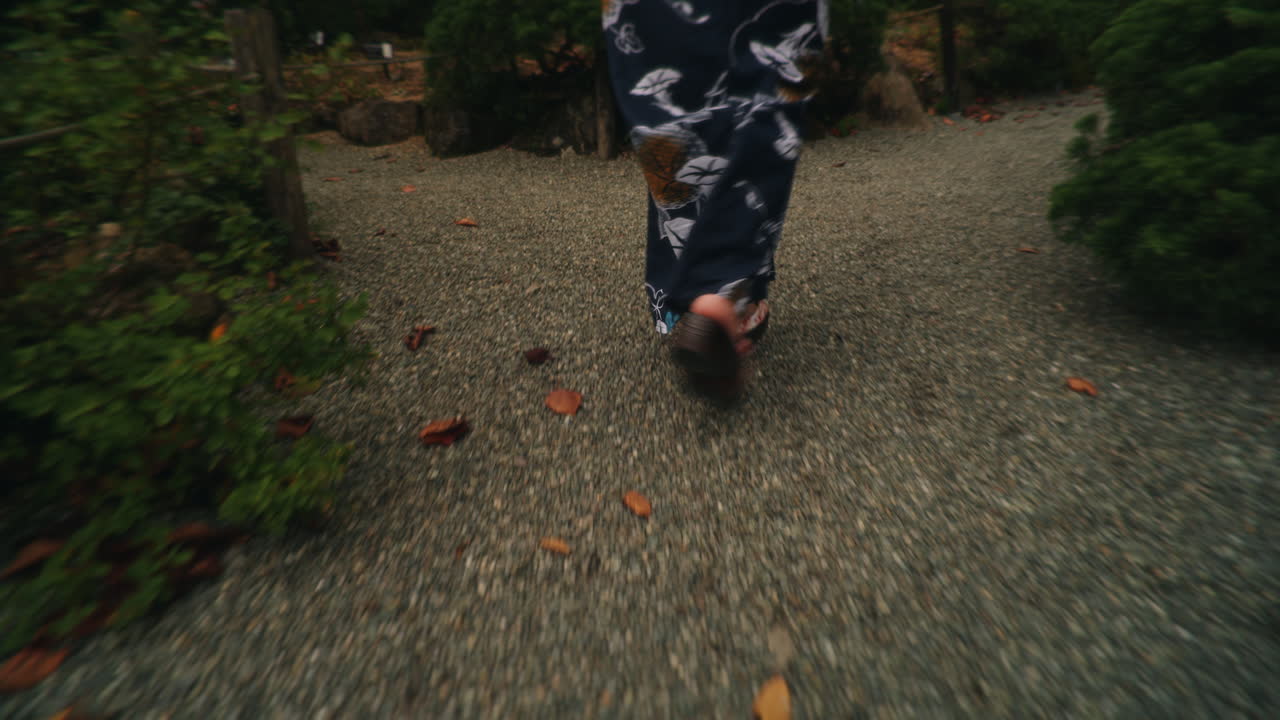 Walking on a Gravel Path in Traditional Japanese Footwear