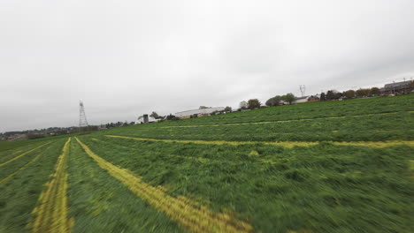 plowed farm field in american rural area during cloudy day