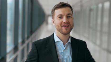 Closeup-portrait-of-an-adult-male-smiling-at-the-camera