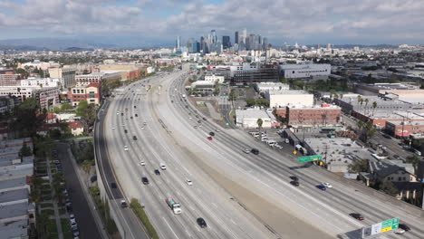 pasadena 110 freeway in city of los angeles on a cloudy day, aerial of downtown la