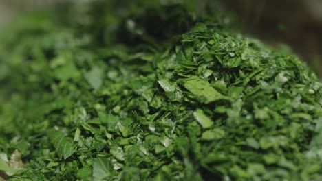 Chopped-parsley-is-placed-in-a-pan