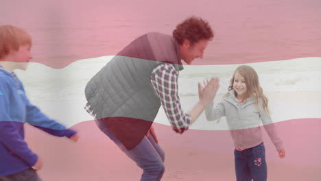 padre e hija en la playa con la animación de la bandera de austria ondeando sobre ellos