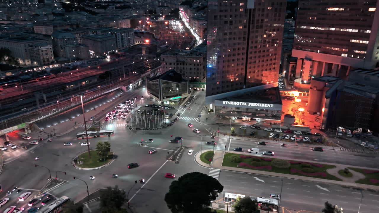 Aerial view over Viale Brigate Partigiane with night traffic in Genoa Italy