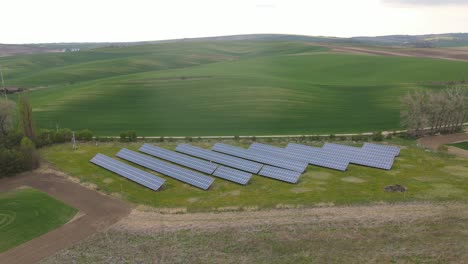 Aerial-drone-view-into-large-solar-panels-at-a-solar-farm