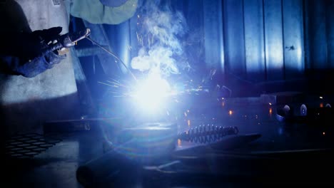 Welder-welding-a-metal