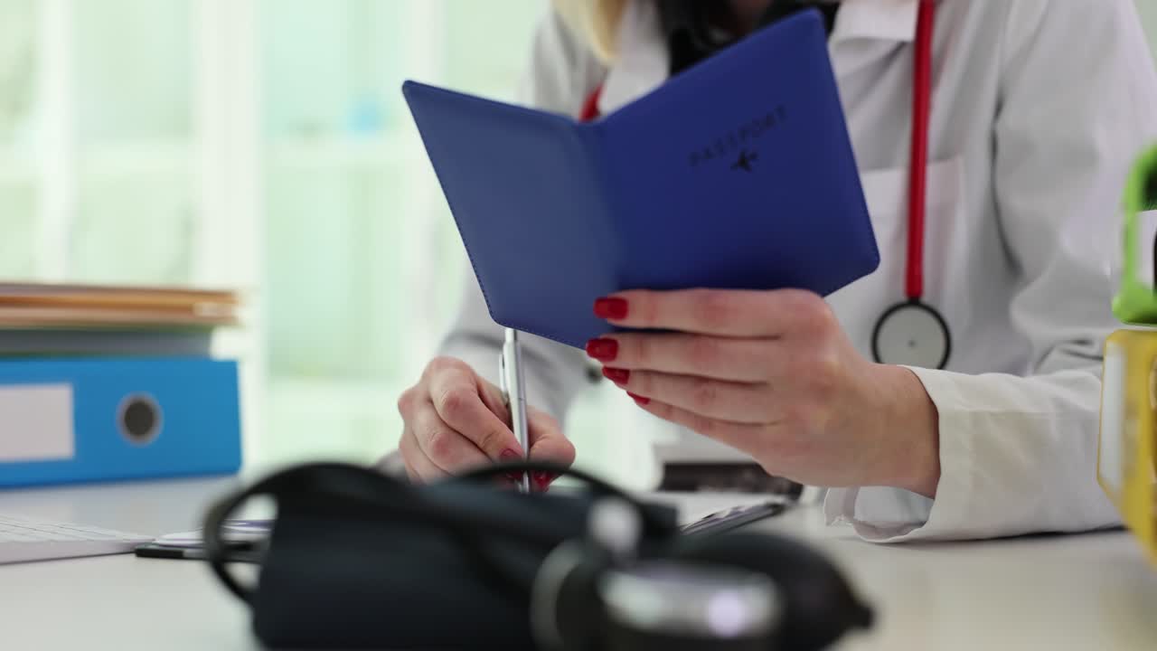 Doctor examining a passport for travel clearance