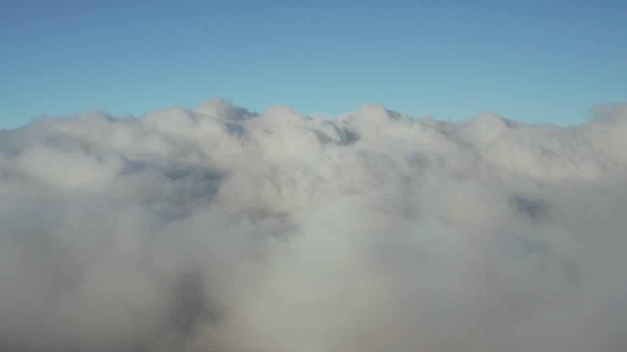 Aerial view above clouds, blue and white, Hawaii